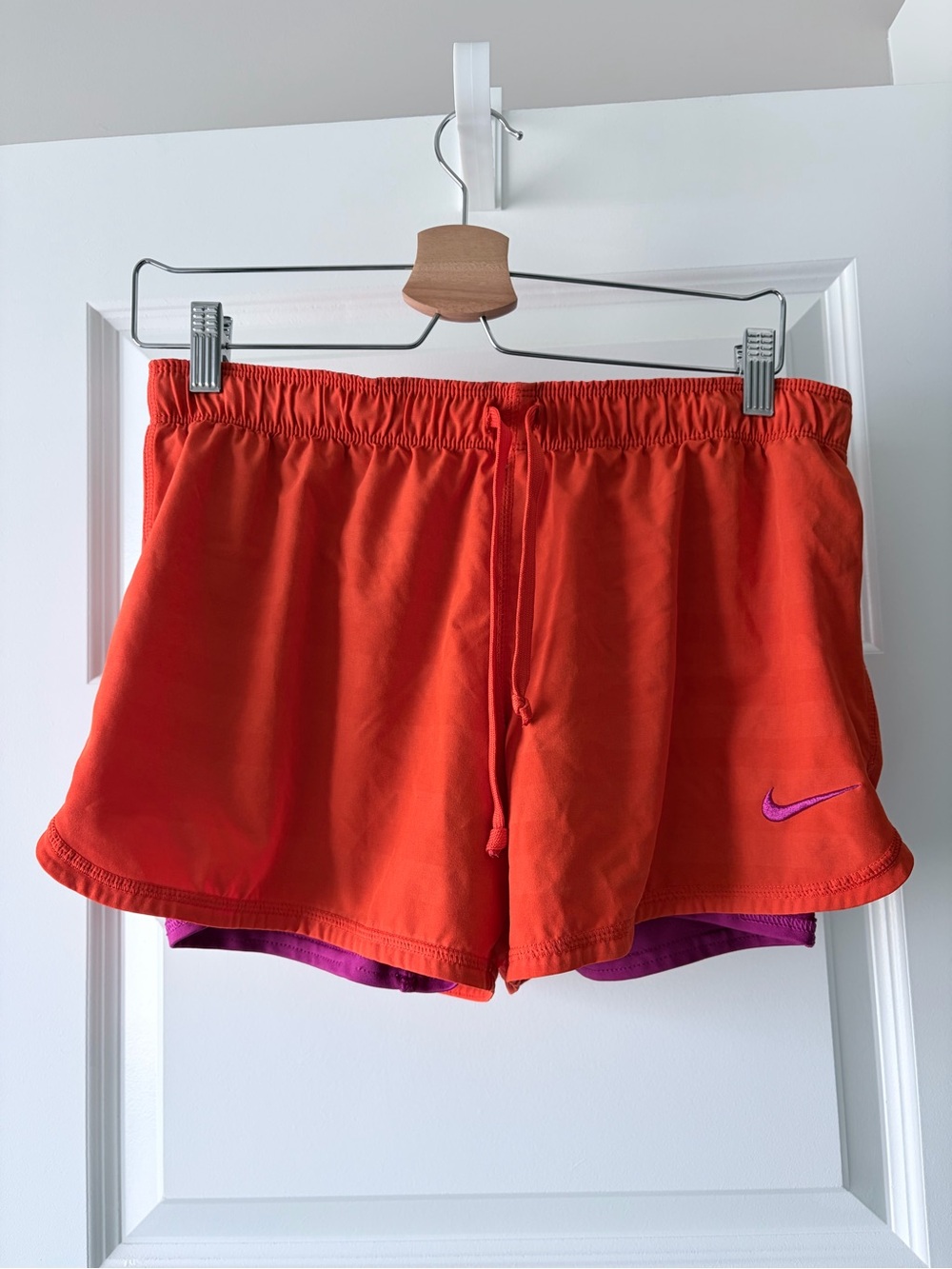 Nike Women’s Orange Subtle Stripe Athletic Shorts with Purple Swoosh